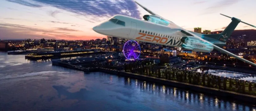 Rendering of hydrogen-electric powered turboprop over a body of water with a cityscape in the background. The aircraft says ZeroAvia on the fuselage.